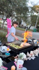Outdoor hibachi chef fire show entertaining guests in Santa Rosa Beach