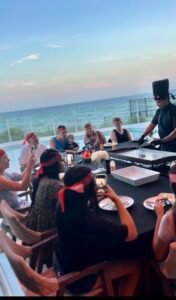 Private hibachi chef cooking for group with ocean view in Destin Florida